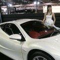 A Thai model poses next to the new Mitsuoka Orochi from Japan at Thailand