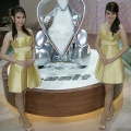 Thai models pose next to the concept vehicle from Toyota's I-Unit from Japan at Thailand