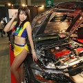 A model presents an ARC-tuned Mitsubishi Lancer Evolution IX at the Tokyo Auto Salon