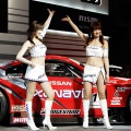 Race queens show off Nismo Fairlady Z Super GT race car at the Tokyo Auto Salon